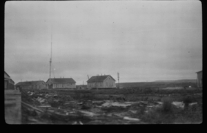 Image of Several small buildings. Radio antenna